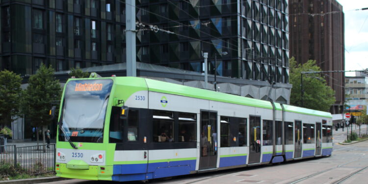 London Tram stopped at East Croydon station with passengers boarding in 2025