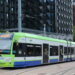 London Tram stopped at East Croydon station with passengers boarding in 2025