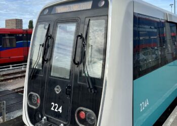 Front view of new DLR train 224 at Beckton depot, showing the modern exterior design.