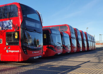 Double decker London buses parked at a garage on Christmas Day