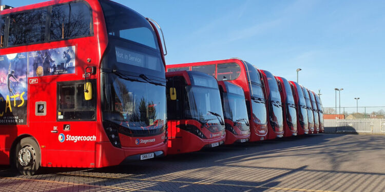 Double decker London buses parked at a garage on Christmas Day