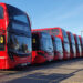 Double decker London buses parked at a garage on Christmas Day