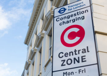 A Transport for London Congestion Charge zone sign on a London street, showing the entrance to the area where all vehicles including electric cars and private hire vehicles will soon pay a new £18 daily fee.