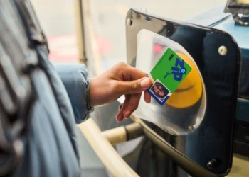 A Zip Oyster photocard being tapped on a card reader on a London bus