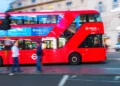 Red Arriva London double-decker bus travelling through central London