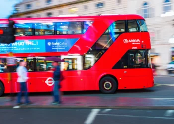 Red Arriva London double-decker bus travelling through central London
