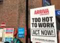 Unite “Too Hot to Work” placard outside Arriva Wood Green bus garage during the August 2026 bus strike.
