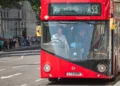 Red London double-decker bus operating in central London