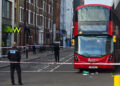 Arriva London route 2 bus behind a police cordon at Vauxhall Bus Station