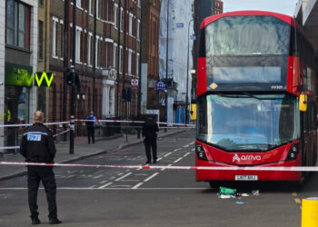 Arriva London route 2 bus behind a police cordon at Vauxhall Bus Station