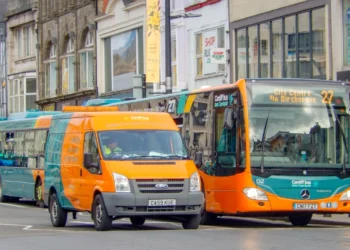 A Cardiff Bus double-decker outside the New Theatre in Cardiff city centre.