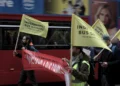 Independent bus drivers carrying yellow flags and a red banner during a demonstration in London.